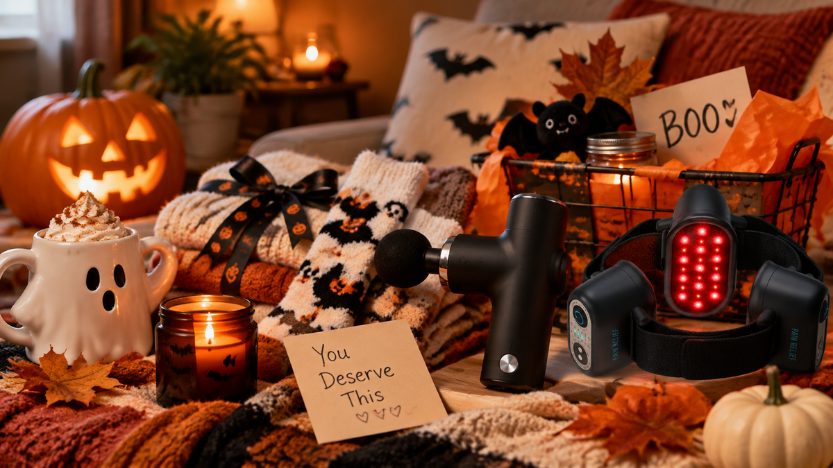 Cozy Halloween self-care gifts with a massage gun and red light therapy wrap creating a relaxing at-home wellness routine